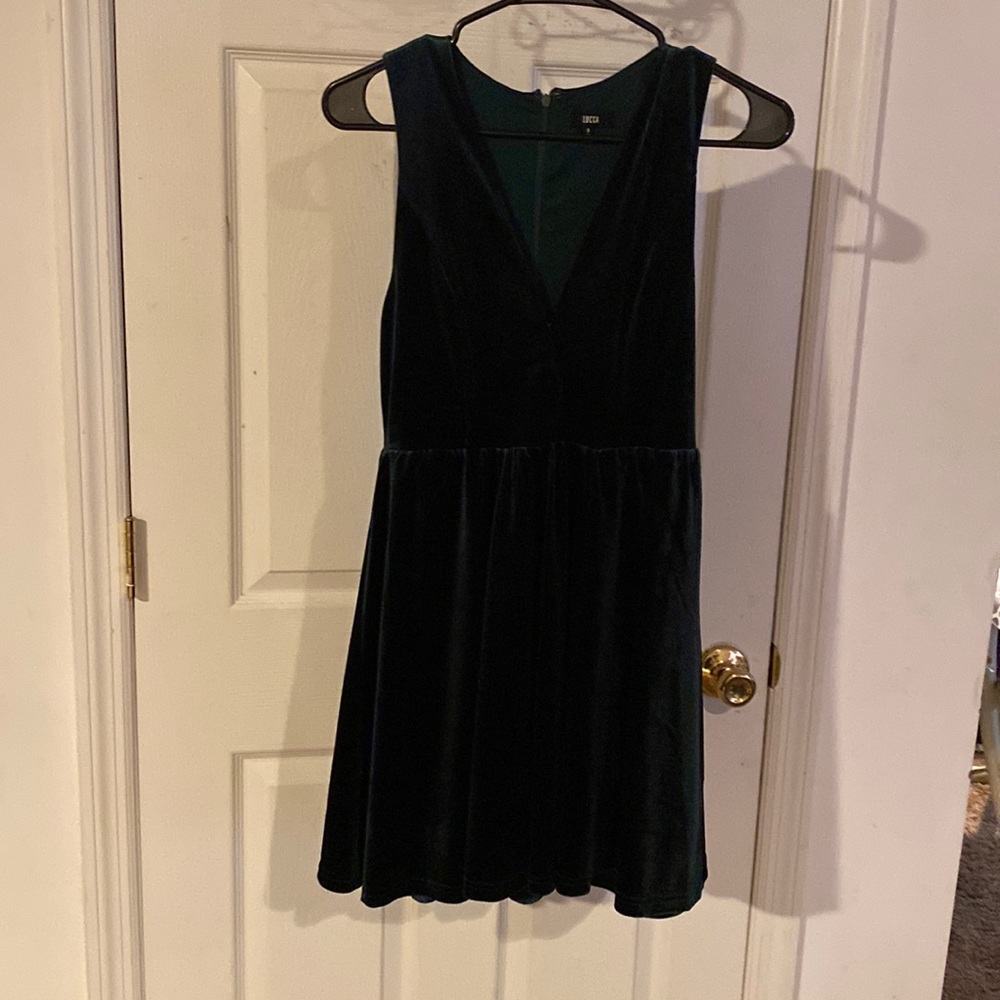 Dark green velvet dress.